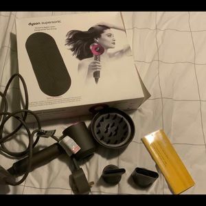 Dyson supersonic hair dryer with original box.